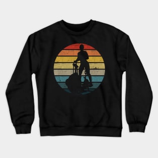 Exercise Bike Silhouette On A Distressed Retro Sunset product Crewneck Sweatshirt